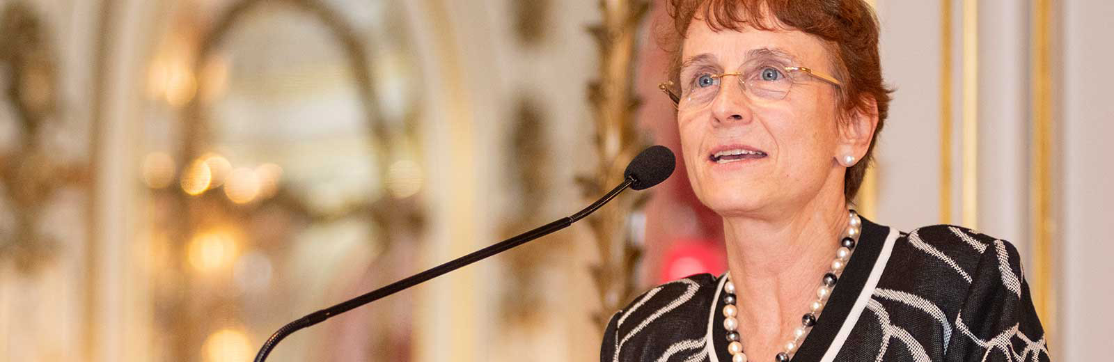 Dr. Christina Puchalski speaking at a podium